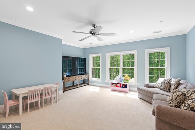carpeted living area featuring ornamental molding, a ceiling fan, baseboards, and recessed lighting