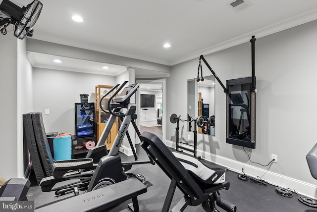 exercise area with crown molding, baseboards, and recessed lighting