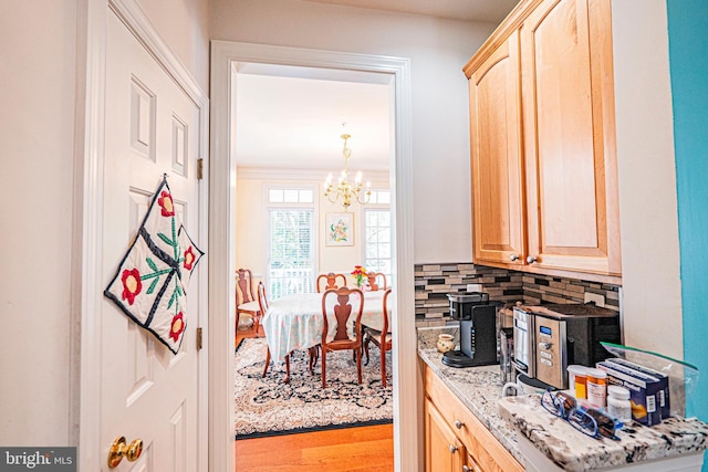 9 Webster Hill Ct, Clarksburg, MD 20871 - kitchen featuring light brown cabinets, a chandelier, tasteful backsplash, wood finished floors, and light stone countertops