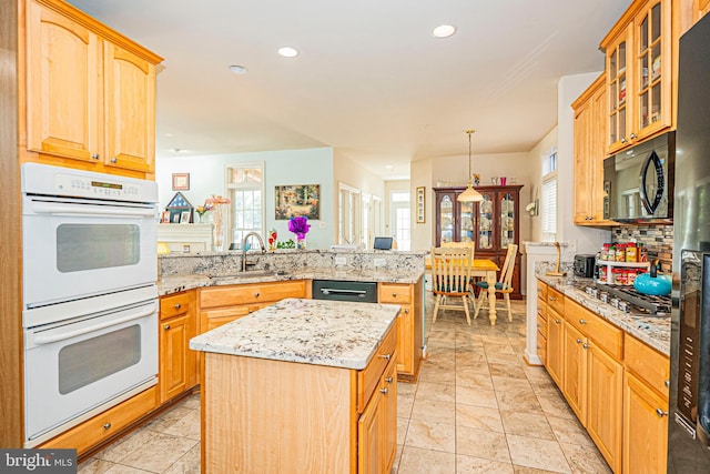 9 Webster Hill Ct, Clarksburg, MD 20871 - kitchen featuring white double oven, a peninsula, black microwave, stainless steel gas cooktop, and backsplash