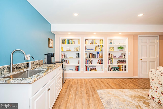 9 Webster Hill Ct, Clarksburg, MD 20871 - kitchen featuring light stone countertops, light wood-style floors, white cabinets, and recessed lighting