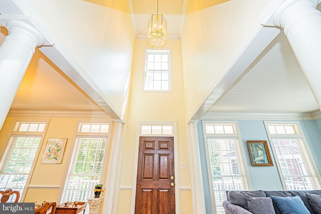 9 Webster Hill Ct, Clarksburg, MD 20871 - entryway with decorative columns, healthy amount of natural light, crown molding, a chandelier, and a towering ceiling