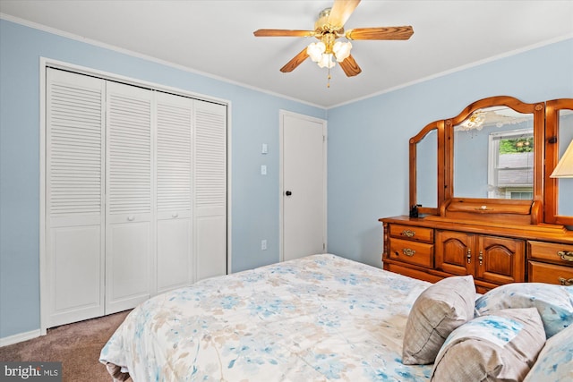 carpeted bedroom featuring a closet, crown molding, and a ceiling fan