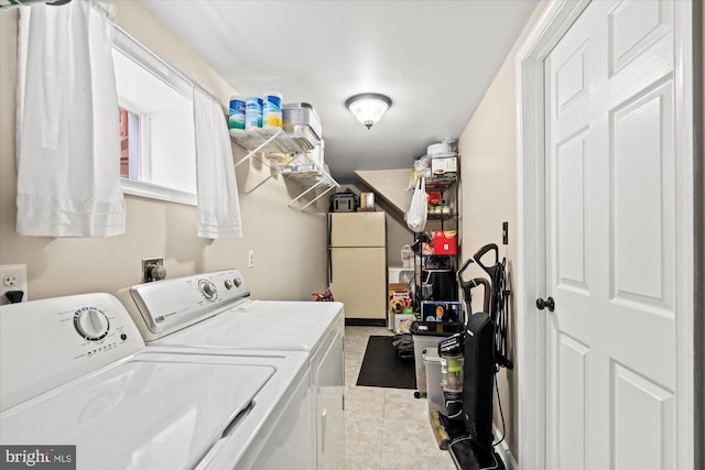 clothes washing area featuring independent washer and dryer