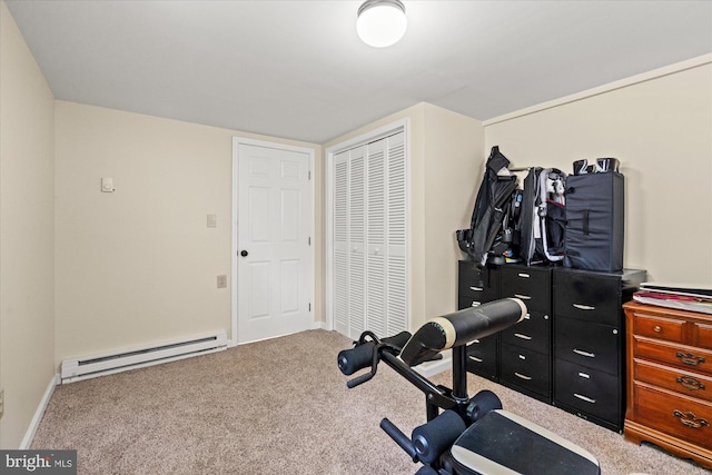 workout room with baseboard heating, carpet flooring, and baseboards