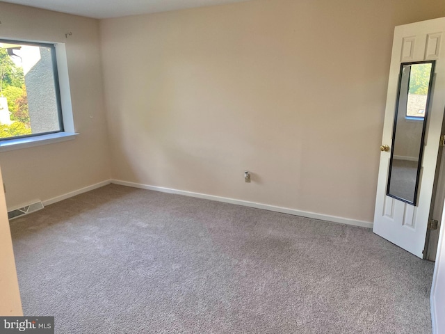 411 Lynetree Dr Unit 12-C, West Chester, PA 19380 - unfurnished room featuring plenty of natural light, carpet floors, and baseboards