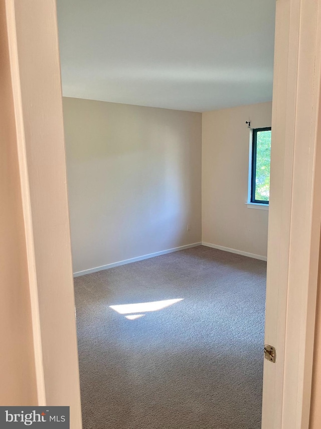 411 Lynetree Dr Unit 12-C, West Chester, PA 19380 - empty room with carpet flooring and baseboards