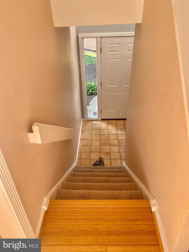 411 Lynetree Dr Unit 12-C, West Chester, PA 19380 - stairs with baseboards and tile patterned floors