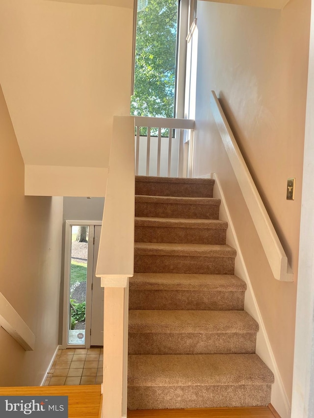 411 Lynetree Dr Unit 12-C, West Chester, PA 19380 - staircase with tile patterned floors and baseboards