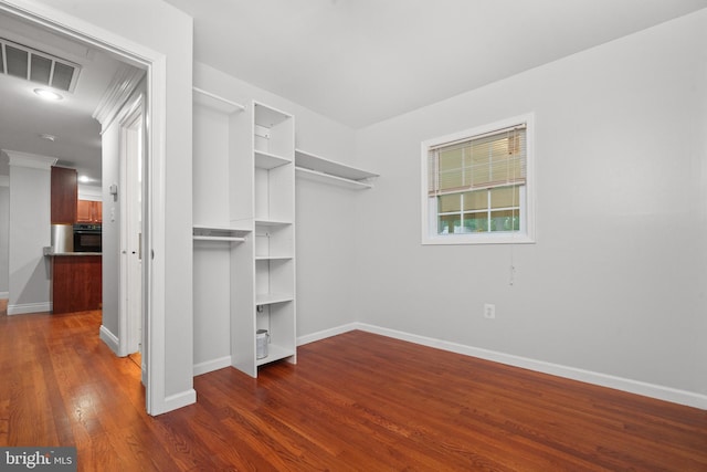 spacious closet featuring dark wood-style floors