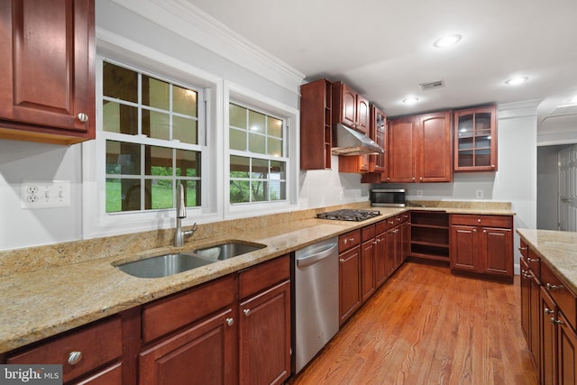 kitchen featuring a sink, stainless steel appliances, under cabinet range hood, light wood-type flooring, and light stone countertops