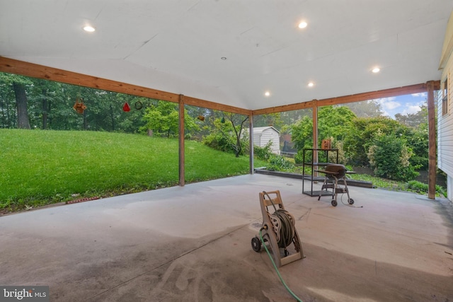 view of patio / terrace featuring a storage unit and an outdoor structure