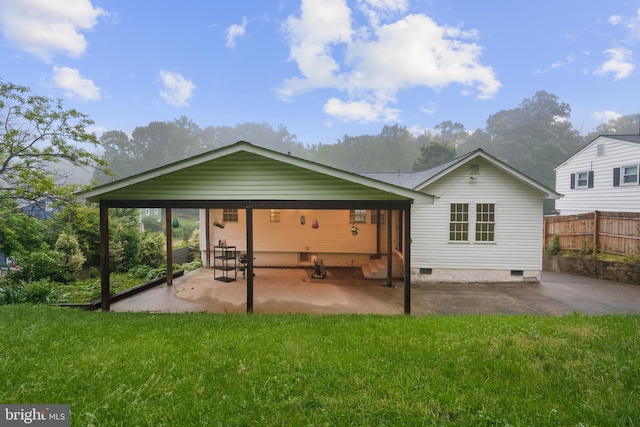 rear view of property featuring crawl space and a patio area