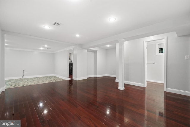 finished basement with hardwood / wood-style floors, baseboards, recessed lighting, and crown molding