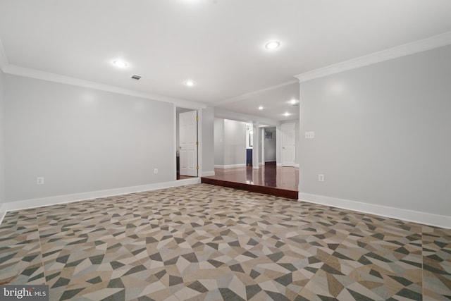 empty room with crown molding, recessed lighting, and baseboards