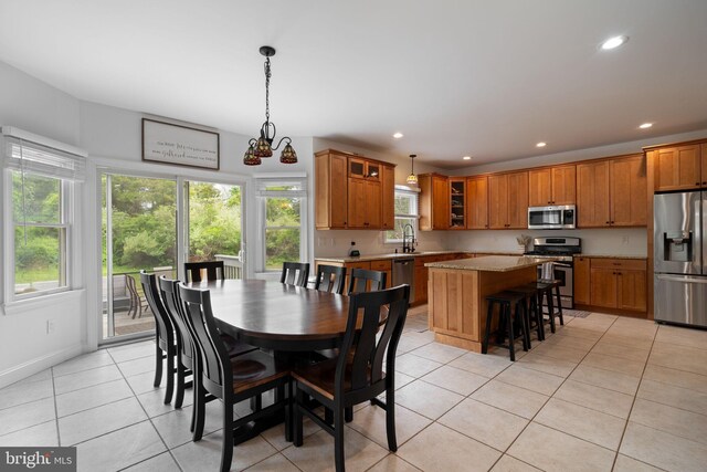 dining space featuring light tile patterned floors, recessed lighting, and baseboards