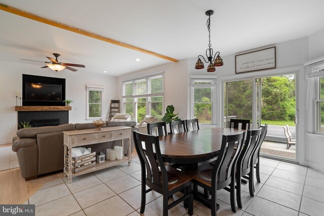 dining space with light tile patterned floors, a brick fireplace, recessed lighting, and ceiling fan