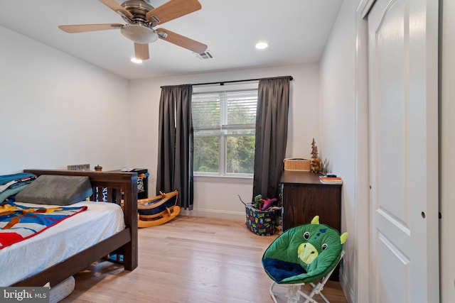 bedroom featuring light wood-style flooring, recessed lighting, baseboards, and a ceiling fan