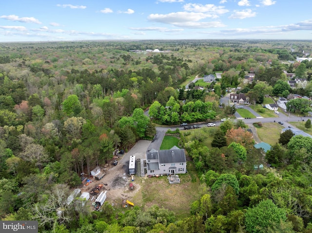 aerial view of property's location with a forest