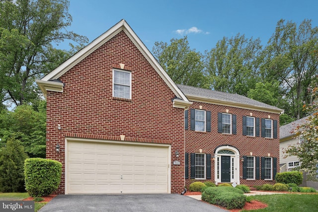 711 Bleak Hill Pl, Upper Marlboro, MD 20774 - colonial inspired home featuring driveway, a garage, and brick siding