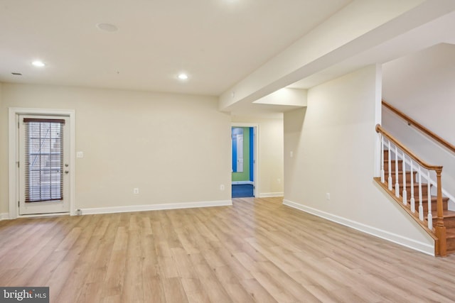 711 Bleak Hill Pl, Upper Marlboro, MD 20774 - unfurnished living room with light wood-type flooring, baseboards, recessed lighting, and stairs