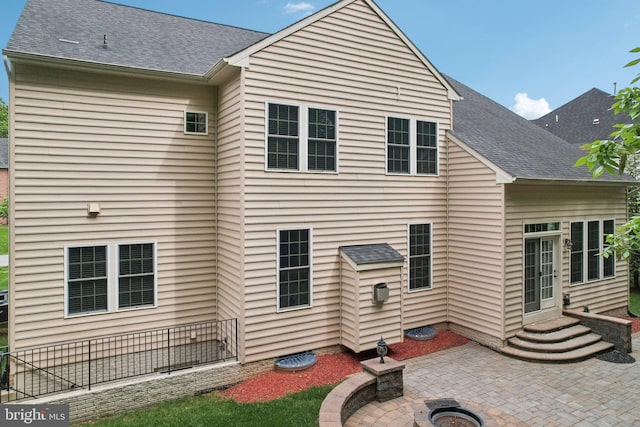 711 Bleak Hill Pl, Upper Marlboro, MD 20774 - back of house with a patio area, an outdoor fire pit, and a shingled roof