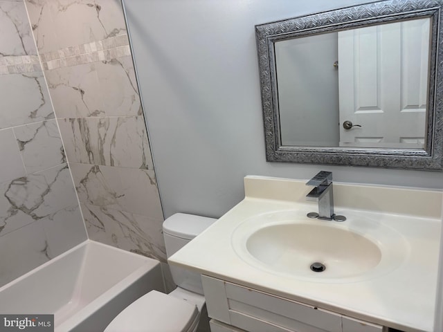 bathroom featuring toilet and vanity