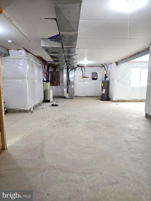 below grade area featuring heating unit, electric panel, and water heater