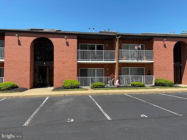 1209 Norwalk Rd Unit 4, Philadelphia, PA 19115 - view of building exterior with uncovered parking