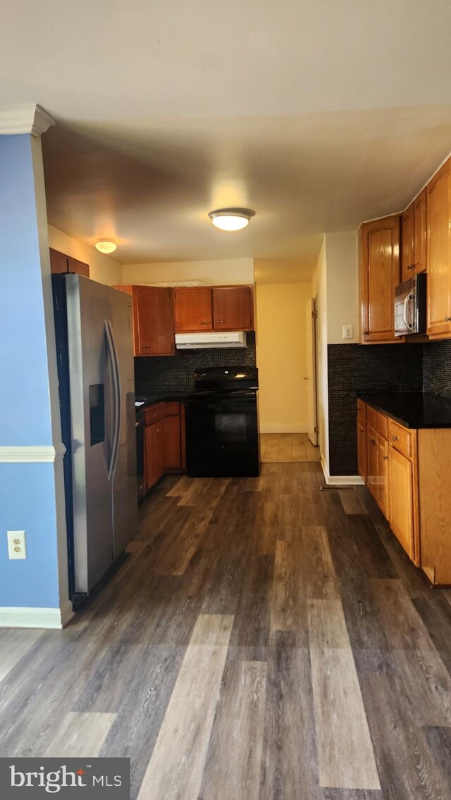 801 S Greenthorn Ave, Sterling, VA 20164 - kitchen with stainless steel appliances, dark wood-type flooring, decorative backsplash, and under cabinet range hood
