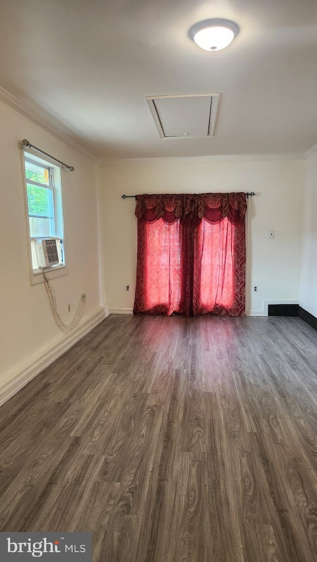 801 S Greenthorn Ave, Sterling, VA 20164 - unfurnished living room featuring dark wood-style floors, ornamental molding, cooling unit, and baseboards