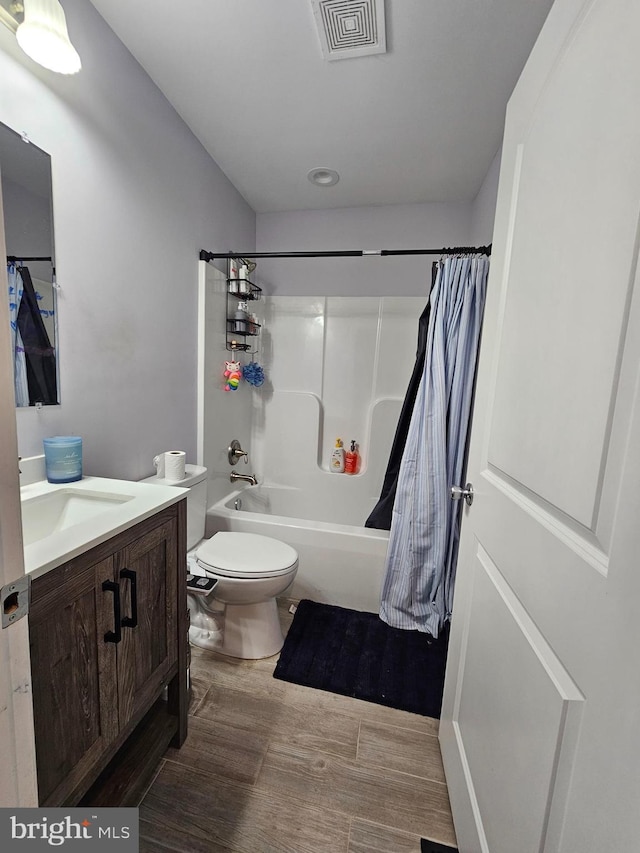 3612 Panhandle Rd, Front Royal, VA 22630 - bathroom featuring vanity, shower / bath combination with curtain, wood finished floors, and toilet