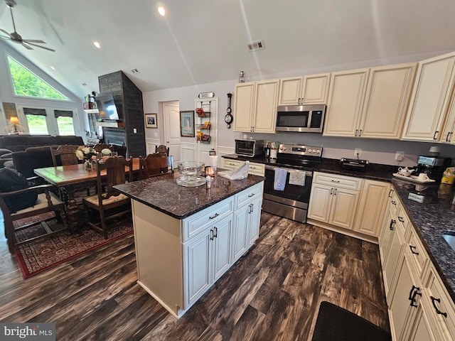 3612 Panhandle Rd, Front Royal, VA 22630 - kitchen featuring appliances with stainless steel finishes, cream cabinets, ceiling fan, open floor plan, and high vaulted ceiling