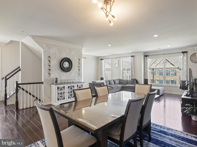 dining space featuring wood finished floors, baseboards, recessed lighting, and stairs