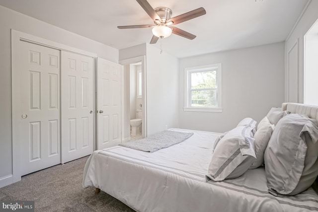 carpeted bedroom with a closet and ceiling fan