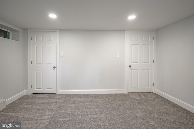 finished basement featuring carpet flooring, recessed lighting, and baseboards