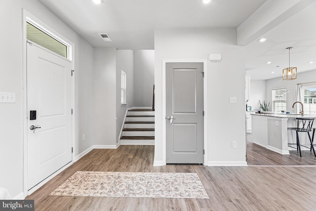 9508 Mourning Dove Way, Delmar, MD 21875 - entryway with wood finished floors, stairway, recessed lighting, and baseboards
