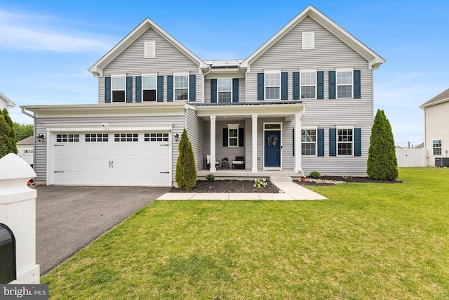 9508 Mourning Dove Way, Delmar, MD 21875 - traditional-style house featuring driveway, a porch, a front lawn, an attached garage, and cooling unit