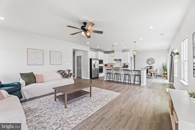 9508 Mourning Dove Way, Delmar, MD 21875 - living area with ceiling fan, wood finished floors, recessed lighting, and baseboards