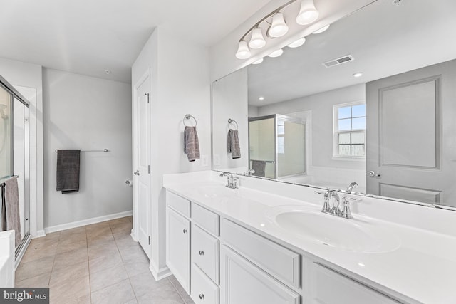 9508 Mourning Dove Way, Delmar, MD 21875 - full bath with a shower stall, double vanity, baseboards, and tile patterned flooring