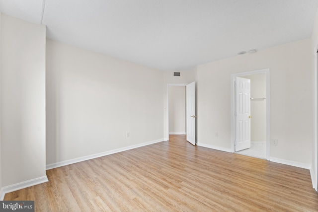 24 Courthouse Sq Unit 710, Rockville, MD 20850 - unfurnished bedroom featuring wood finished floors and baseboards