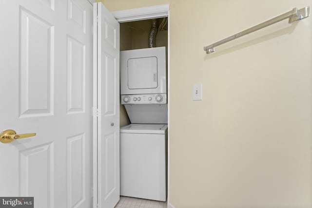 24 Courthouse Sq Unit 710, Rockville, MD 20850 - clothes washing area featuring stacked washer / drying machine