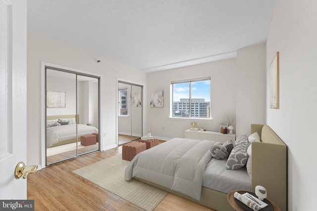 24 Courthouse Sq Unit 710, Rockville, MD 20850 - bedroom featuring multiple closets and wood finished floors