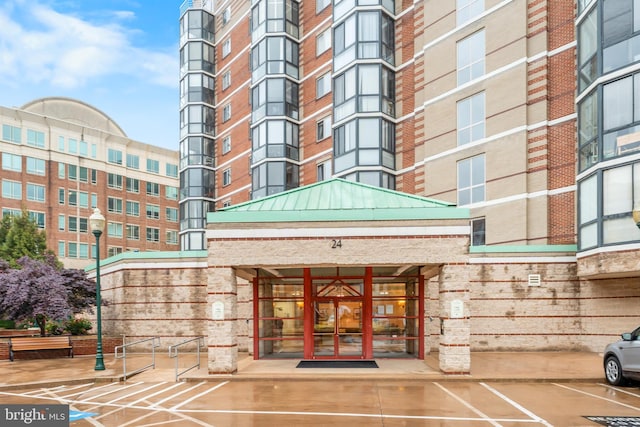 24 Courthouse Sq Unit 710, Rockville, MD 20850 - doorway to property with french doors and brick siding