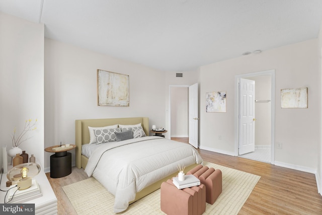 24 Courthouse Sq Unit 710, Rockville, MD 20850 - bedroom with light wood finished floors and baseboards