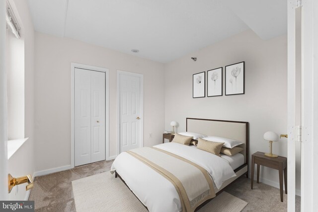 24 Courthouse Sq Unit 710, Rockville, MD 20850 - bedroom with light colored carpet and baseboards