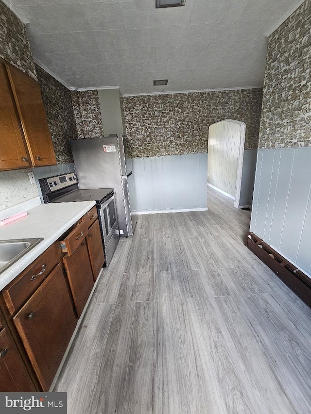 1137 W Walnut St, Ashland, PA 17921 - kitchen with light wood-style floors, light countertops, stainless steel electric stove, a sink, and dishwasher