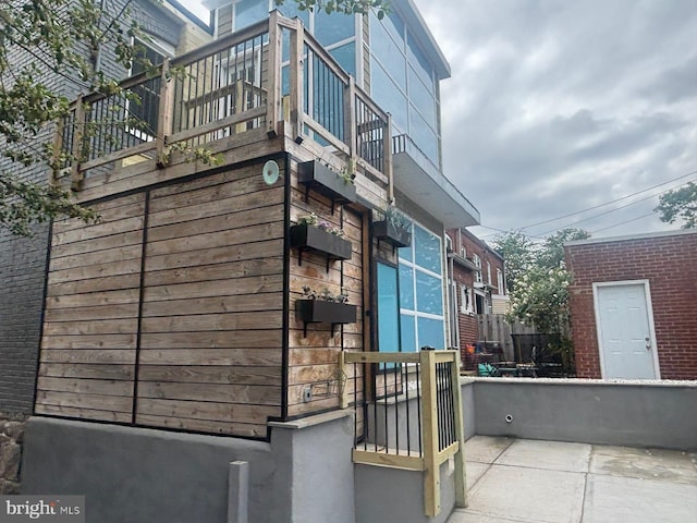 view of property exterior featuring a balcony