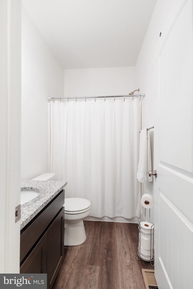 205 Kinneman Rd, Abbottstown, PA 17301 - full bathroom with wood finished floors, vanity, toilet, and curtained shower