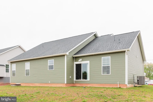 205 Kinneman Rd, Abbottstown, PA 17301 - back of house with a lawn, cooling unit, and a shingled roof